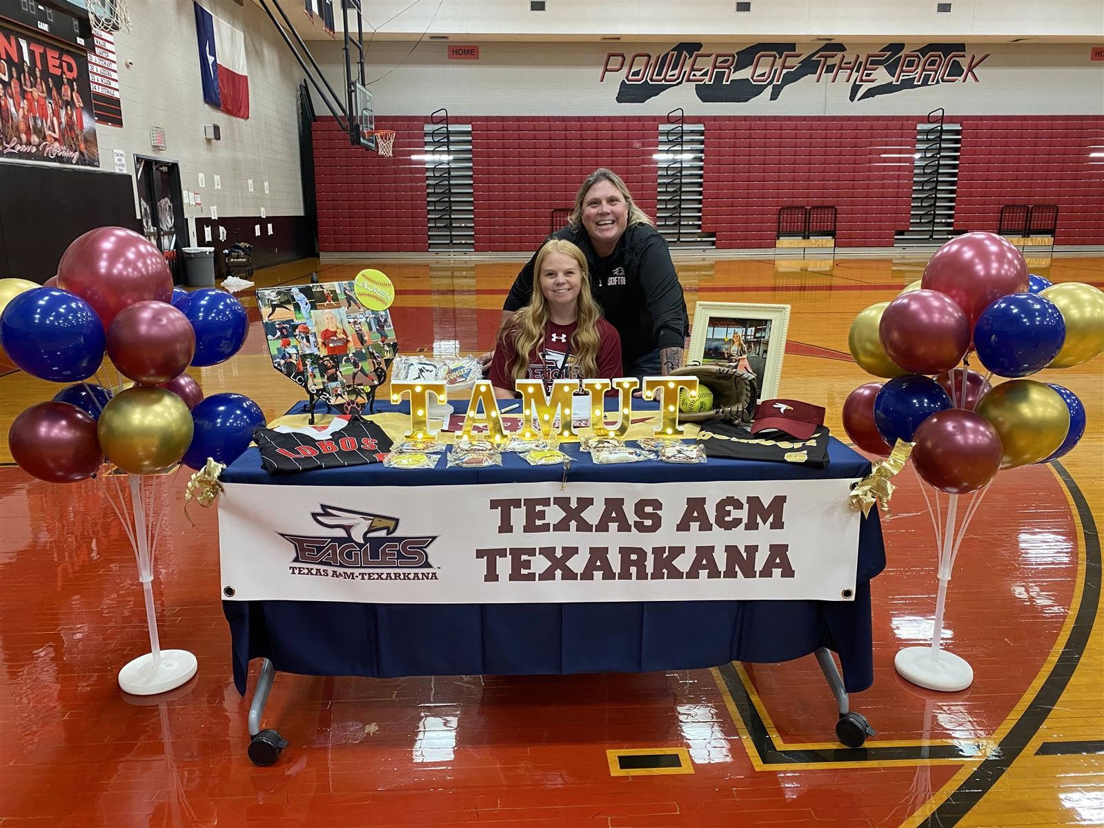 Langham Creek senior Lauren Cox, seated, signed a letter of intent to play softball at Texas A&M University-Texarkana.